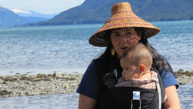 A woman collects seaweed